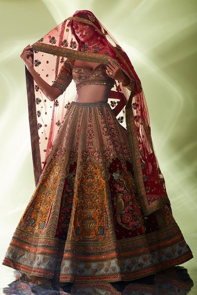 Maroon and mustard hand embroidered lehenga by Designer