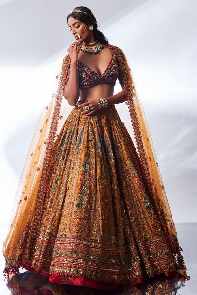 Maroon and mustard hand embroidered lehenga by Designer