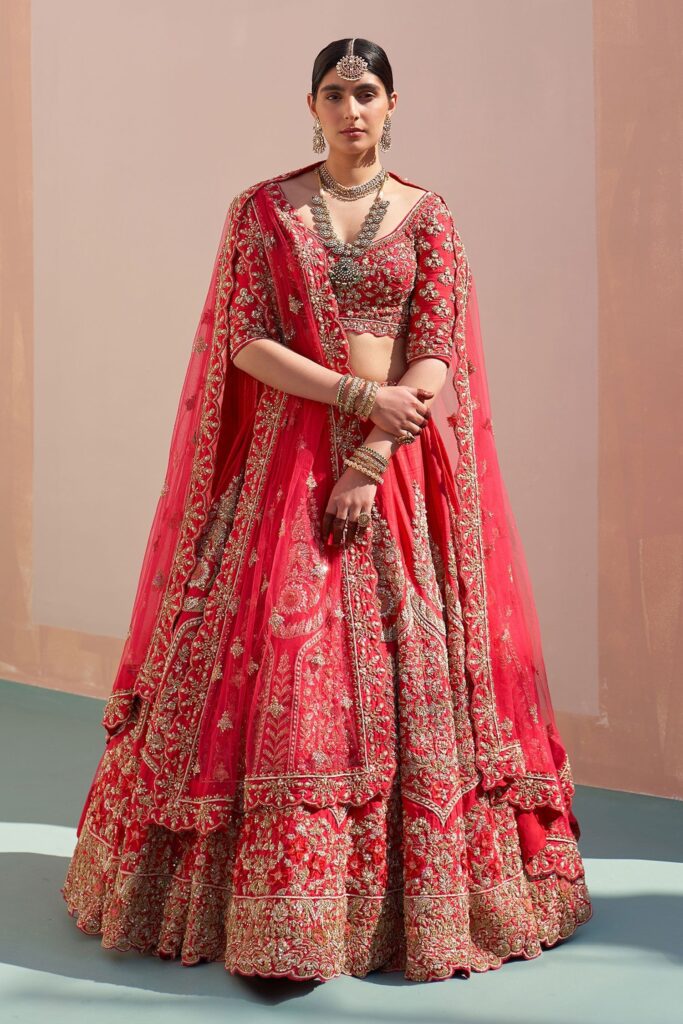 Buy Red Raw Silk Embroidered Zardozi Plunge Neck Bridal Lehenga Set For Women by Angad Singh Online at Aza Fashions.