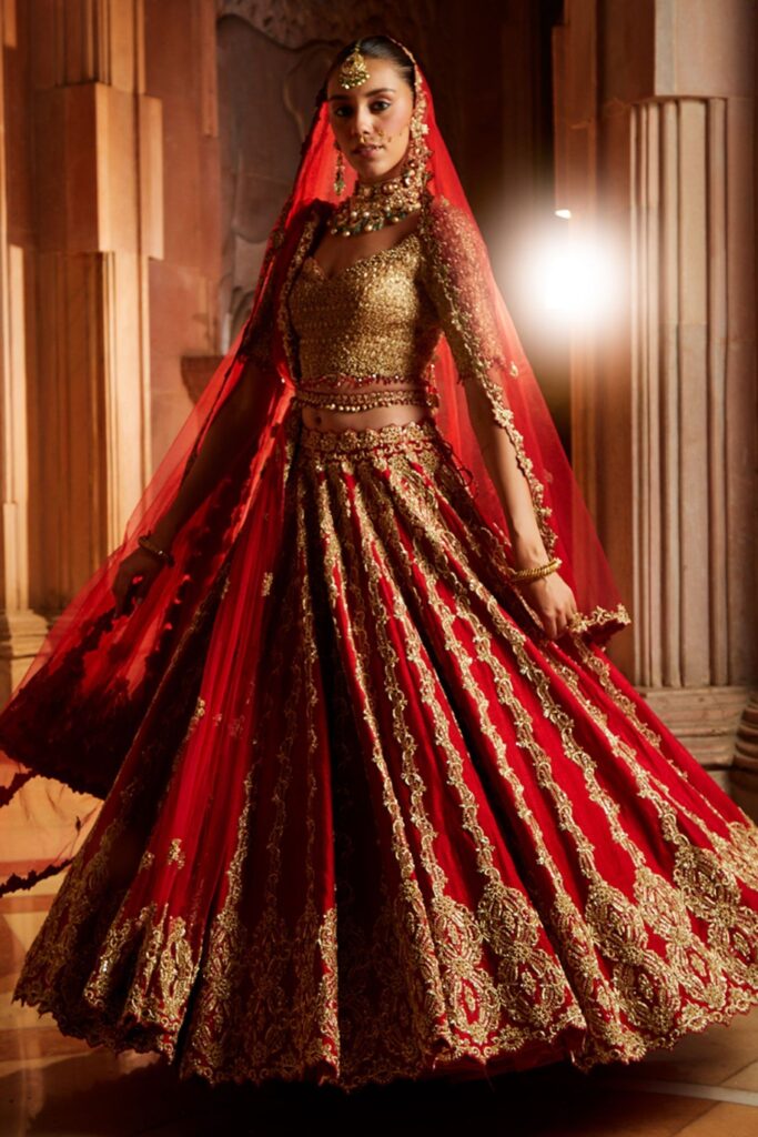 Buy Red Raw Silk Embroidered Zardozi Sweetheart Neck Bridal Lehenga Set For Women by Nitika Gujral Online at Aza Fashions.