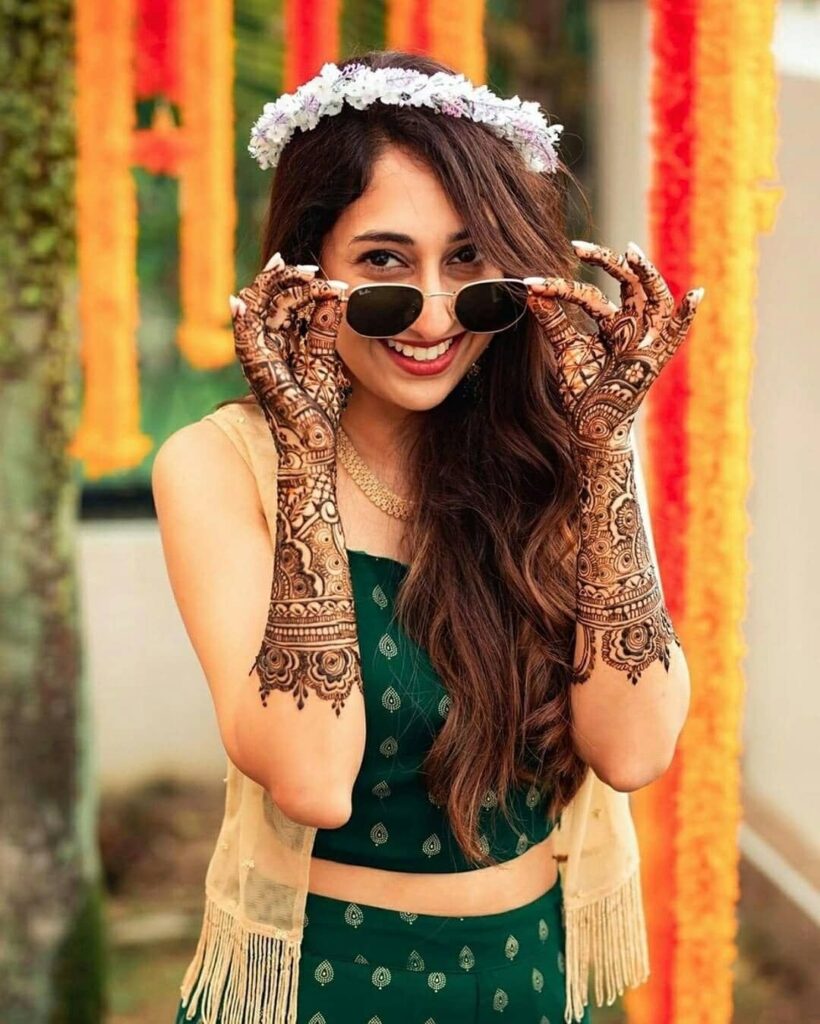 Happy Indian bride at her mehndi function.