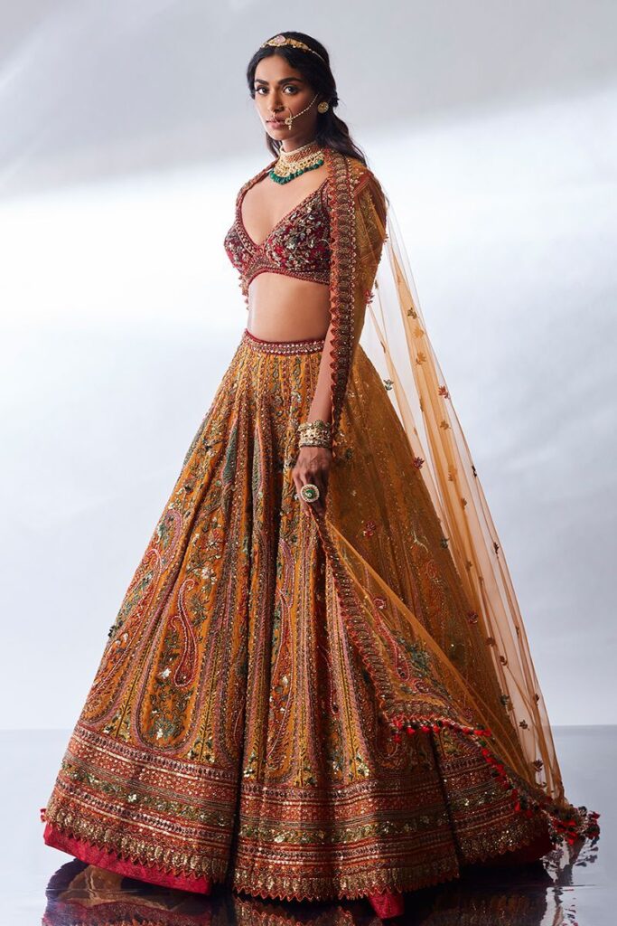 Maroon and mustard hand embroidered lehenga by Designer