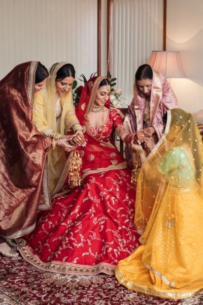 A Beautiful Day Wedding With The Bride In A Ravishing Red Lehenga