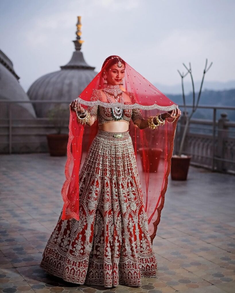 Bride Donned Falguni And Shane Peacock’s Stone Studded Crimson Lehenga On Her Wedding Day