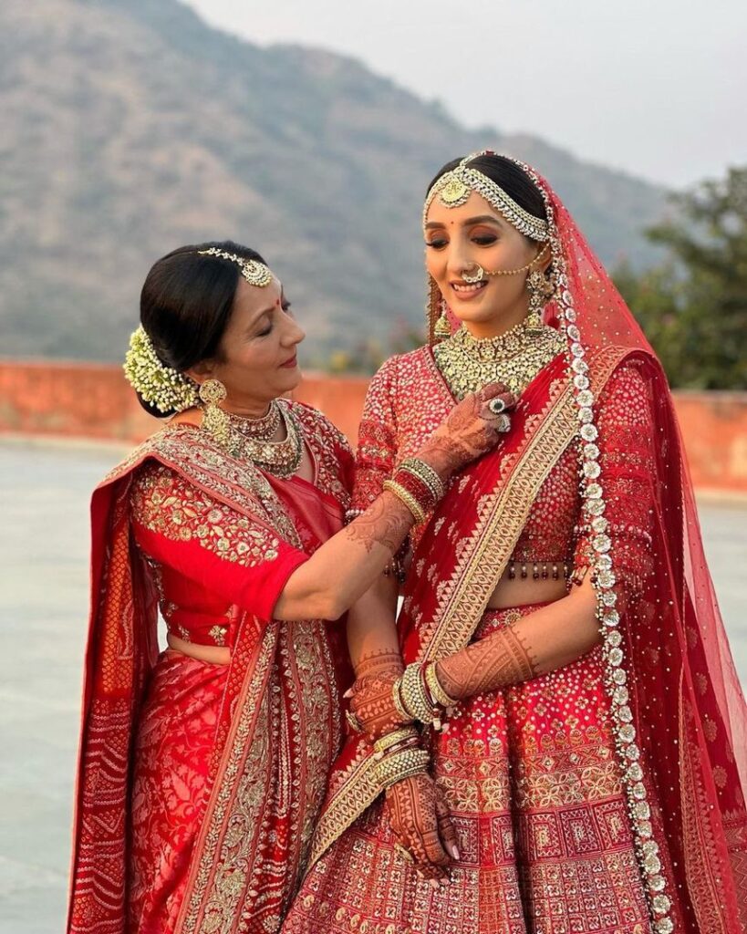 Bride & Mother Duo in Coordinating Red Lehenga