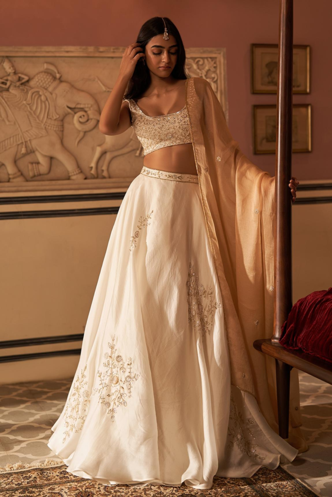 Buy Ivory Satin Organza Embroidery Aari U Neck Placement Lehenga Set For Women by Zoon Online at Aza Fashions.