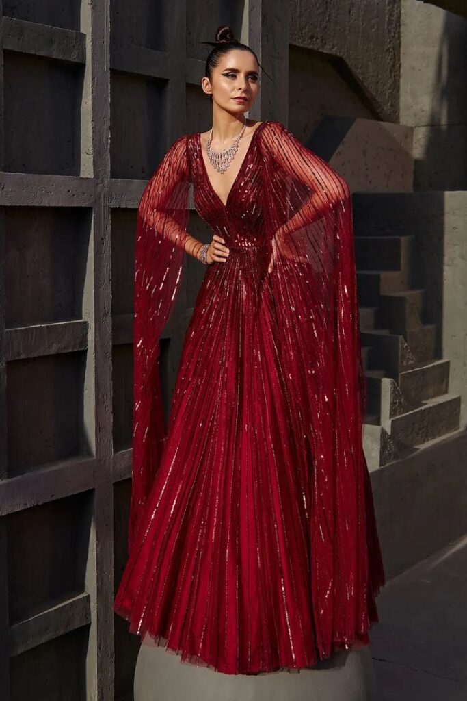 Buy Wine Red Butterfly Net Sequin Embellished Gown with Attached Cape Sleeves at Aza Fashions