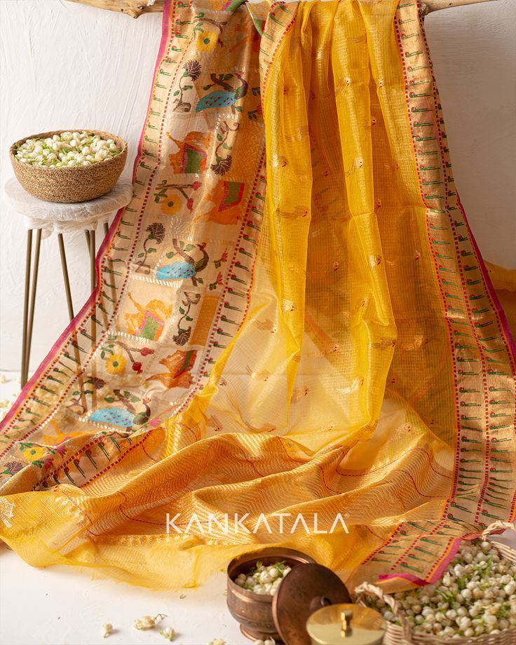 Drape yourself in this Yellow-hued Kota Tissue Butta Silk saree handpicked by us!