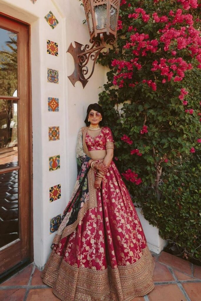 Indian bride in a red Sabyasachi lehenga