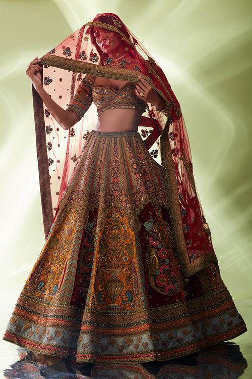 Maroon hand embroidered lehenga by Designer