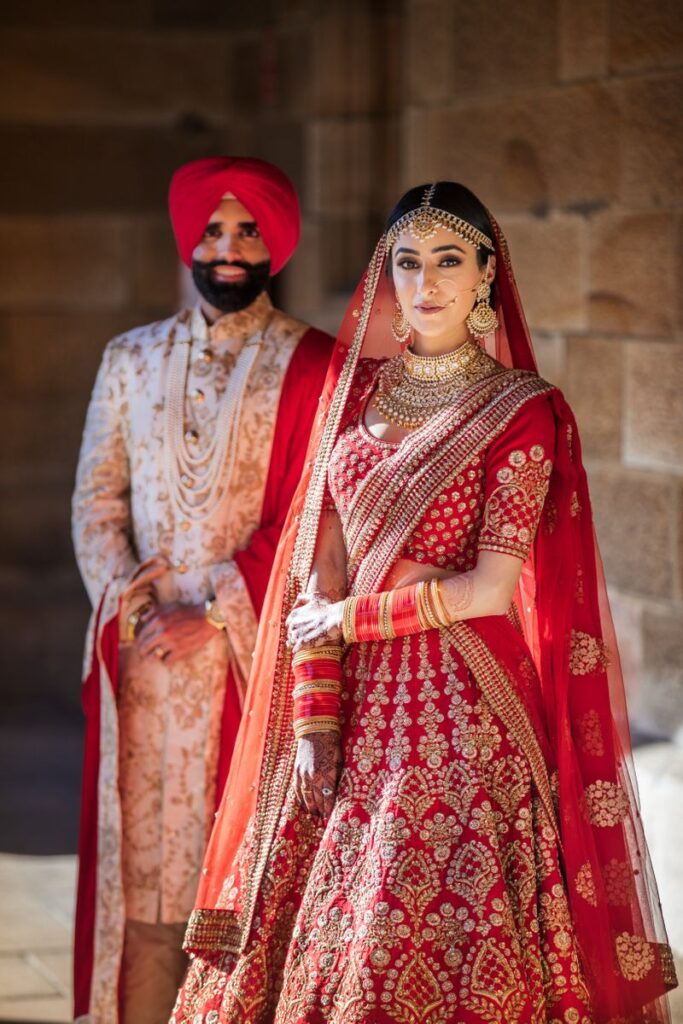 Photo of A color-coordinated couple posing on their wedding day.