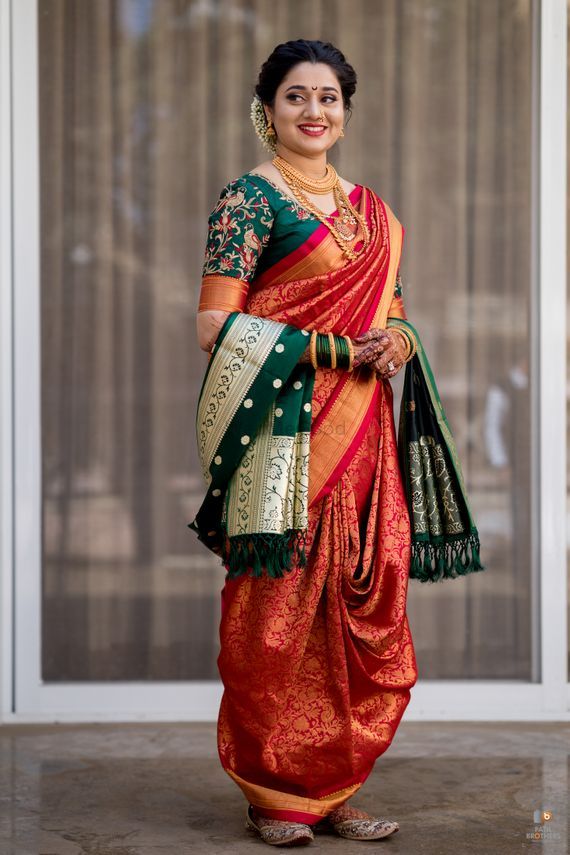 Photo of A happy Marathi bride in silk nauvari saree.