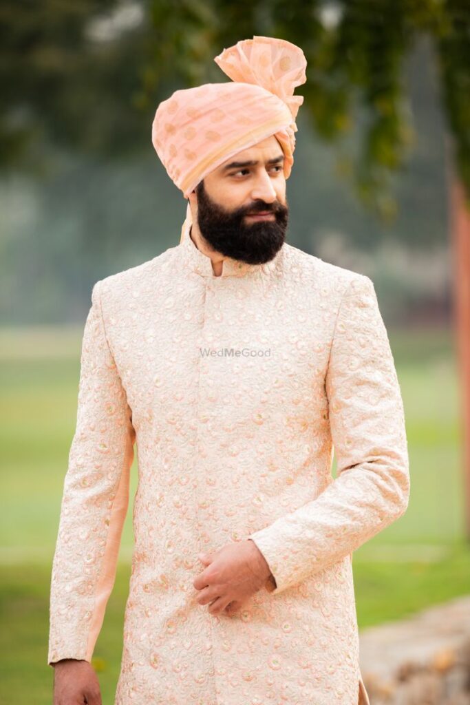 Photo of Peach chikankari sherwani with safa