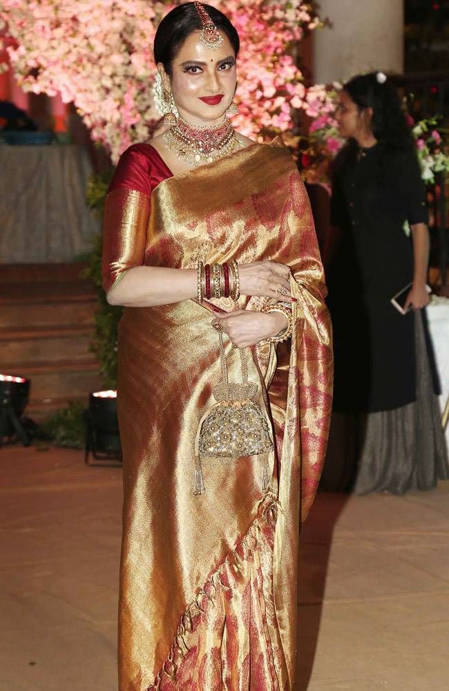 Rekha glows in red and gold at wedding, John and wifey Priya look picture-perfect at Force 2 screening